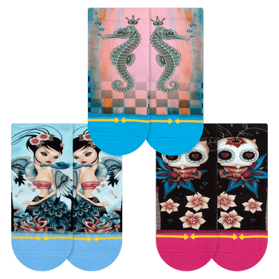 three pairs of socks, sea horse, dancing lady, owl with flowers.